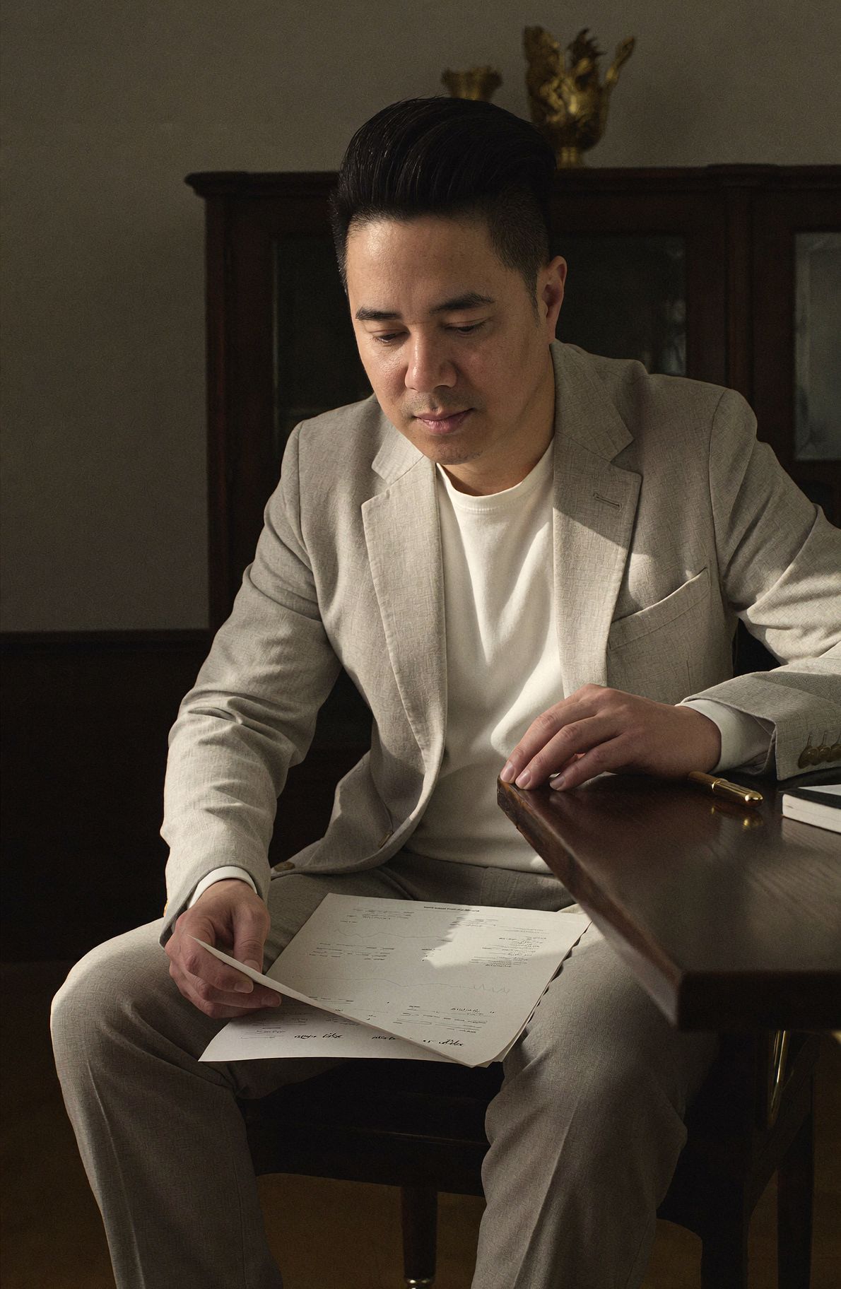 Tony Mai reviewing investment research